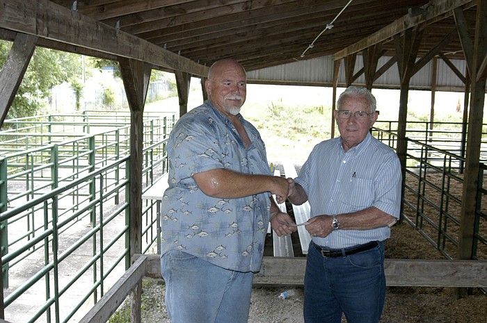 California Kiwanis Vice President Eugene Wickham, left, presents the winning check for the Kiwanis event to Kenny Kunze, who accepted the check on behalf of winner Jordan Kunze, who could not be present.