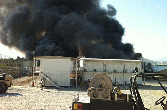 A fire rages in the aftermath of an April 15 attack on Forward Operating Base Finley Shields outside of Jalalabad, Afghanistan.