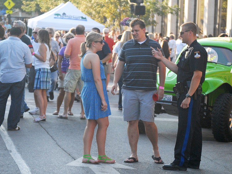 Jefferson City Police keep an eye on the crowd during the Thursday Night Live event held on High Street. In the future, the City Council will discuss funding the law enforcement presence at such events.