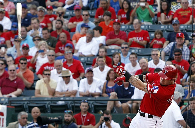 Josh Hamilton of the Rangers loses his bat on a swing during Wednesday night's game against the Tigers in Arlington, Texas. Hamilton could break the record for most All-Star votes when the final totals are released Sunday.