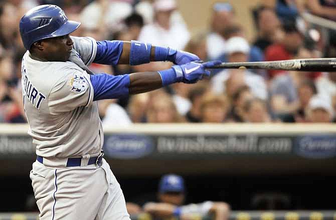 Kansas City Royals' Yuniesky Betancourt doubles to drive in a run against the Minnesota Twins in the fifth inning of a baseball game, Friday, June 29, 2012, in Minneapolis.