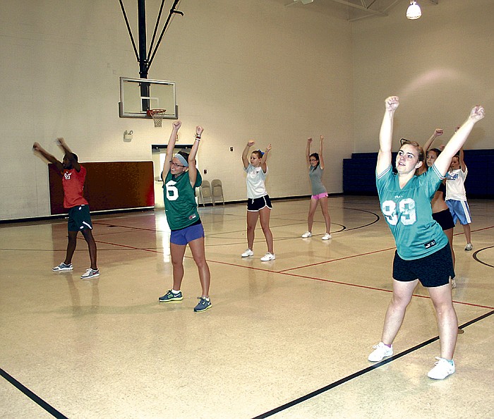 Sports Crusaders instruct the California High School cheerleaders at Cheer Camp Thursday at the California Elementary School gym. From left are Terry Flowers, Jonesboro, Ark., Savannah Page, Lamar Ark., and Sarhea Hall, Fulton.