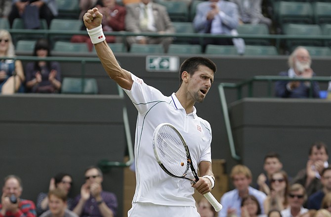 Novak Djokovic celebrates during his quarterfinal win Wednesday over Florian Mayer  at the All England Lawn Tennis Championships at Wimbledon, England.