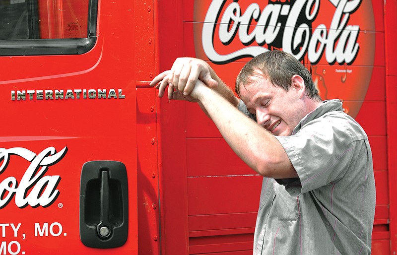 Brian Judge wipes the sweat off his face after making his last delivery of the day Friday at the Elks Lodge. The driver for Coca-Cola said in this extreme heat, he's been making two deliveries a week to places where he normally makes only one. He's looking forward to some cooler temperatures in the next week, as are most area residents. 