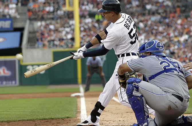 Detroit Tigers' Quintin Berry, left, connects for a two-run triple to deep center during the third inning of a baseball game against the Kansas City Royals in Detroit, Friday, July 6, 2012.
