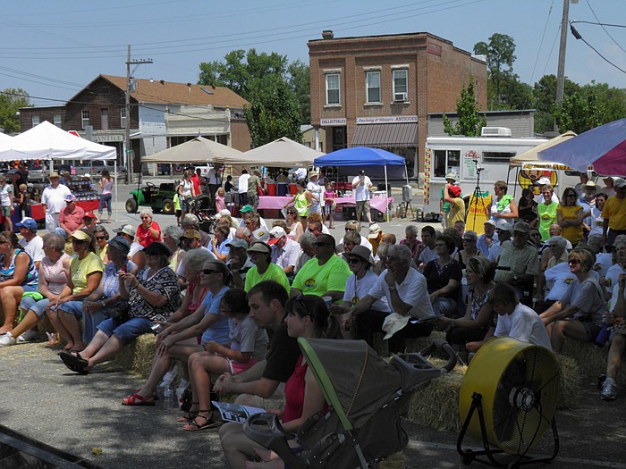 Many came out and tried to get in the shade and avoid the heat during the Jamestown 175th Birthday Celebration Opening Ceremony held Saturday, July 7, at the Burgers' Smokehouse Stage.