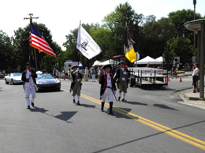 Jamestown City Marshal Bob Walters along with a color guard dressed in traditional garb led the way for the Jamestown 175th Birthday Celebration Parade, Saturday, July 7.