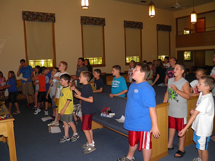 Boys sing "I am Free" during worship.