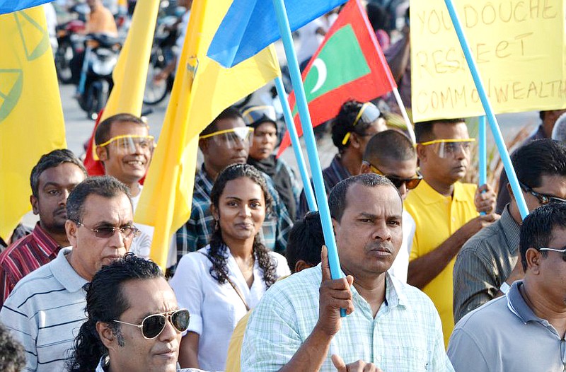 Shauna Aminath, center, a former Westminster College student in Fulton, participates in a recent demonstration calling for a return to democracy in the Republic of Maldives.