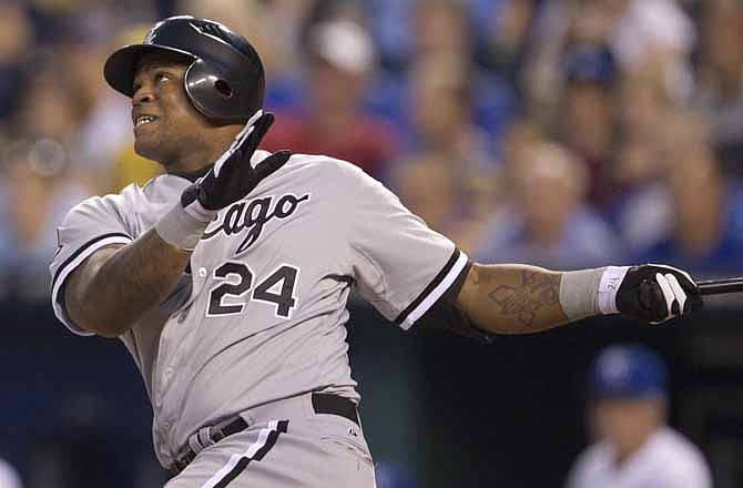 Chicago White Sox's Dayan Viciedo (24) hits a three-run home run off Kansas City Royals starting pitcher Bruce Chen during the fifth inning of a baseball game in Kansas City, Mo., Friday, July 13, 2012.
