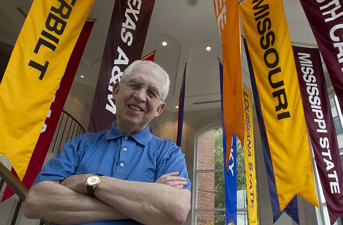 SEC commissioner Mike Slive posed at the conference headquarters Thursday in Birmingham, Ala.