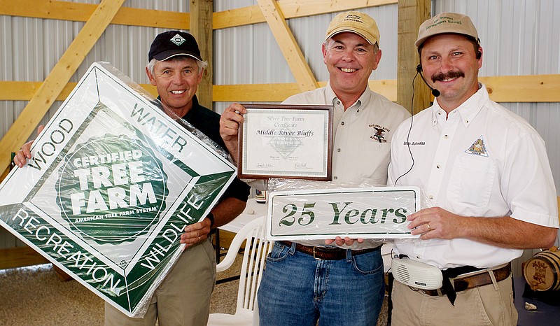 Carey Riley (center), a Callaway County forest owner, accepts a forestry management award from Rick Meritt (left), president of the Missouri Tree Farm Program, and Brian Schweiss, a Missouri Department of Conservation advisor to the program.