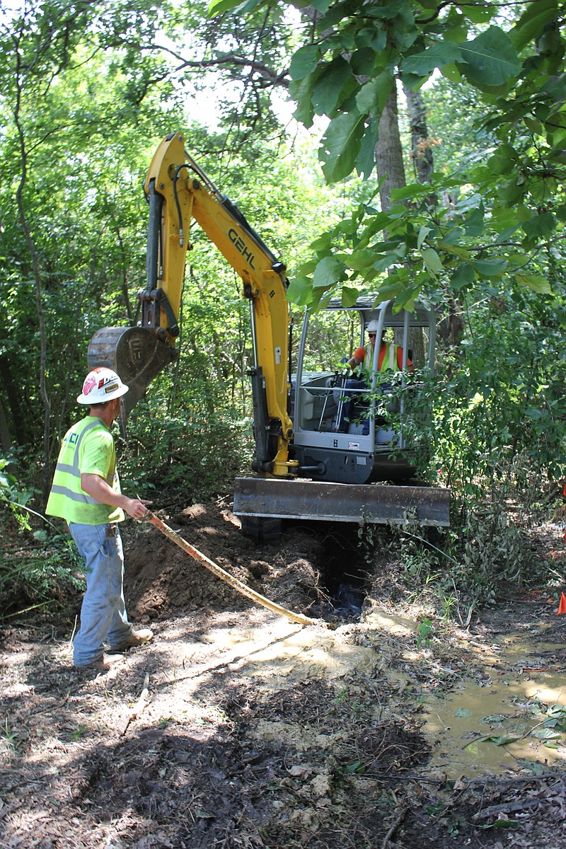 Workers dig out earth July 16 along U.S. 54 between routes F and H for new fiber optic cable installations in Callaway County and across the state. The cables, owned by Bluebird Network, will benefit area hospitals, schools, government institutions and service providers.