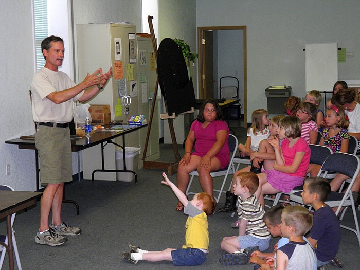 Phil Schroeder gave a presentation on the solar system and star constellations during the Wood Place Public Library's kindergarten through fourth grade Summer Reading Program Activity held Thursday, July 12. "Starry Night" was the theme for the week.