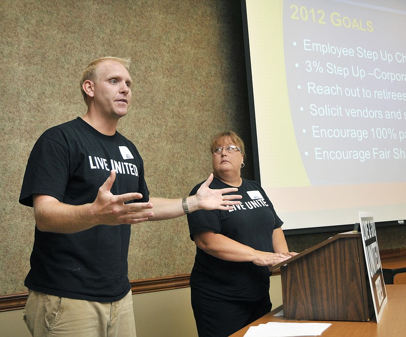 Jake Green and Lori Massman, co-chairs of this year's United Way charitable drive, give ideas to Pacesetter groups to try and match or beat funds raised in last year's campaign.
