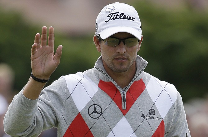 Adam Scott reacts after a birdie on the 15th hole Thursday at Royal Lytham & St. Annes golf club during the first round in Lytham St. Annes, England.