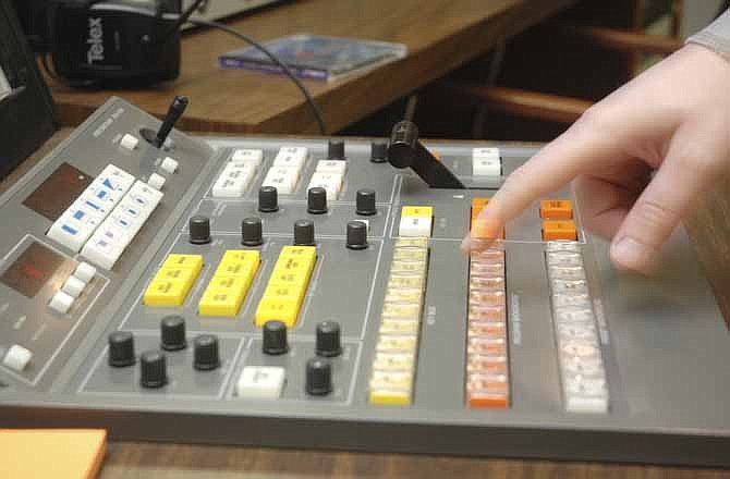 An operator at JCTV runs the board during production at the facility on the campus of Lincoln University. (News Tribune file photo)