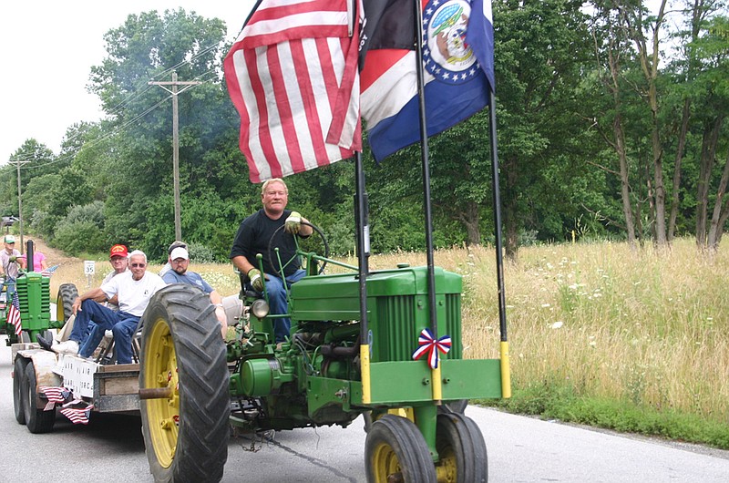 A tractor-drawn float makes its way through Millersburg as part of one of the town's Celebration Day parades. This year will feature a hamburger and hot dog dinner, carnival games for kids and door prizes.