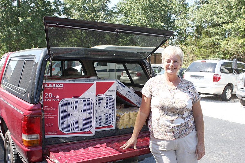 Connie Cashion, better known to Callaway residents in need of help as "Miss Connie," collects some items at SERVE, Inc. to add to her "free store." The truck was recently donated by another individual who wanted to help Cashion's mission to provide assistance "One person at a time."