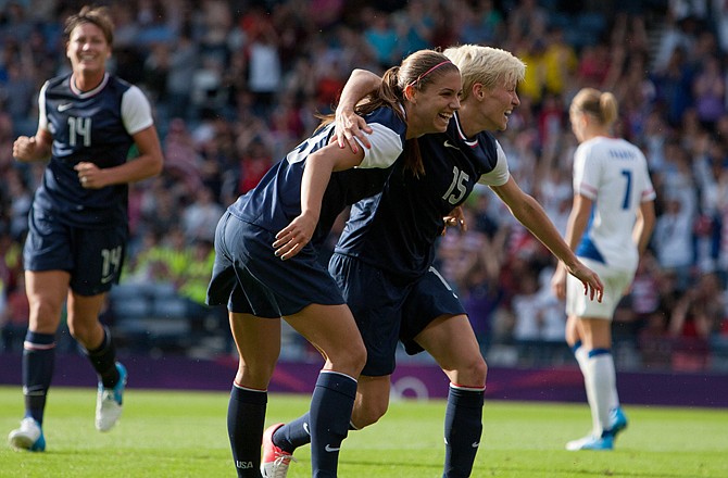 Alex Morgan celebrates with U.S. teammate Megan Rapinoe (15) after scoring her second goal in Wednesday's 4-2 win against France in Glasgow, Scotland.