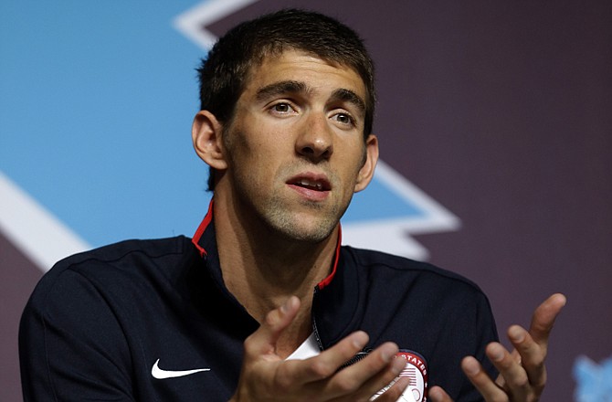 U.S. swimmer Michael Phelps reacts at a press conference Thursday in London. The 14-time gold medalist insists these are his last Olympic Games.