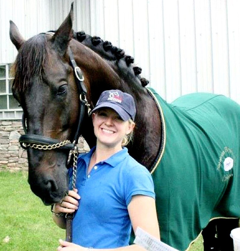 Lauren Donahoo, a William Woods University equestrian graduate, will serve as a groom for Calecto V. Calecto, a big black Danish Warmblood stallion and one of the horses on the U.S. Dressage team competing in the Olympic Games in London.