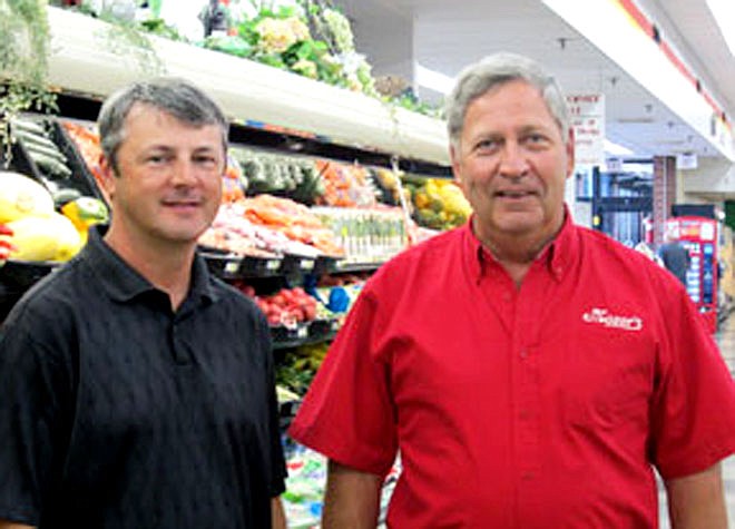 Roger Moser, right, owner of Moser's Supermarkets, provided the lead contribution of $2,500 to Matt Gowin, left, president of the Fulton Colleges Board of Associates. The organization has collected $48,000 to provide 22 scholarships this fall to Callaway County students attending either Westminster College or William Woods University in Fulton.