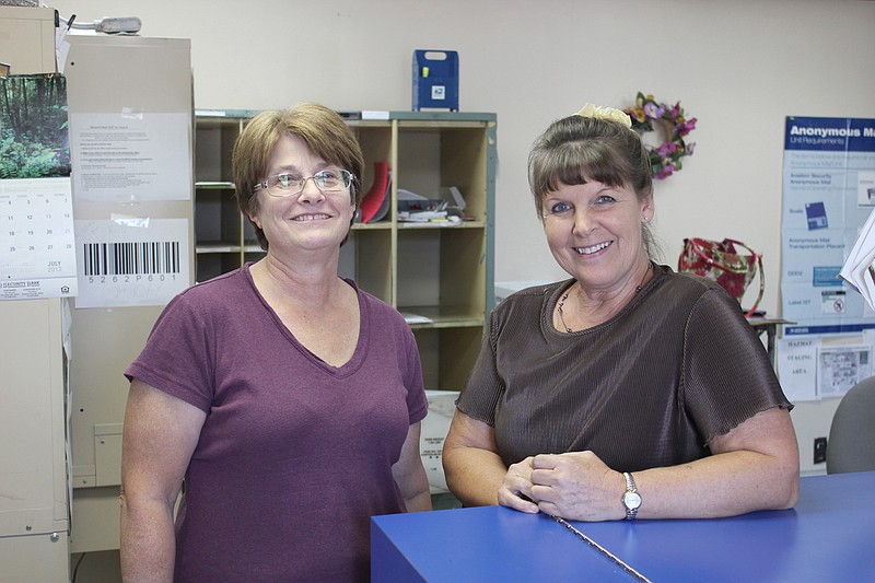 Postmaster Marilyn Farley, left, with the Kingdom City Post Office had her last day before retirement Tuesday. Rhea Horstman, right, will be the new officer in charge of the Kingdom City location.