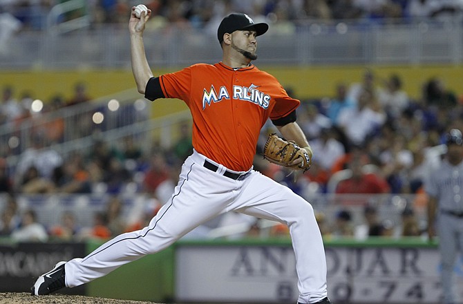 Edward Mujica throws a pitch for the Marlins in Sunday's game against the Padres in Miami.