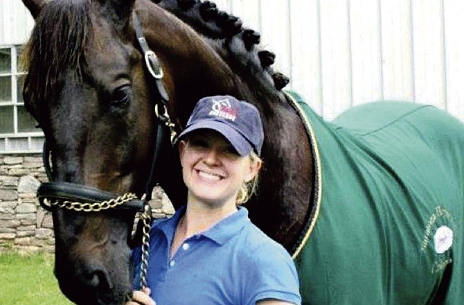 Lauren Donahoo, a William Woods University equestrian graduate, will serve as a groom for Calecto V. Calecto, a big black Danish warmblood stallion and one of the horses on the U.S. Dressage team competing in the Olympic Games in London.