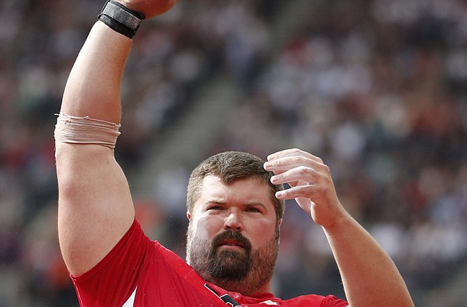 The United States' Christian Cantwell, an Eldon native, prepares for an attempt in the men's shot put qualification Friday in the Olympic Stadium in London.