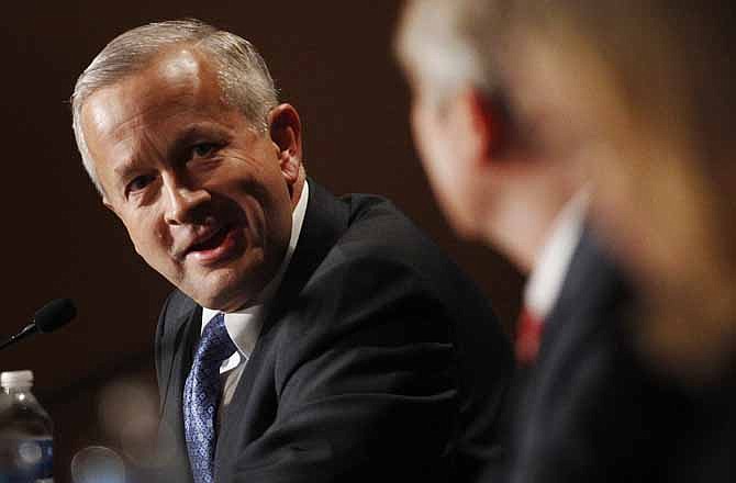 In this Saturday, Feb. 18, 2012 file photo, Senate candidate John Brunner speaks to the other candidates during a forum at a Republican conference in Kansas City, Mo. Brunner, the former CEO and chairman of health and beauty care giant Vi-Jon Inc., has forced his way into a three-way battle featuring a congressman and a former state treasurer that will be decided Tuesday, Aug. 7.