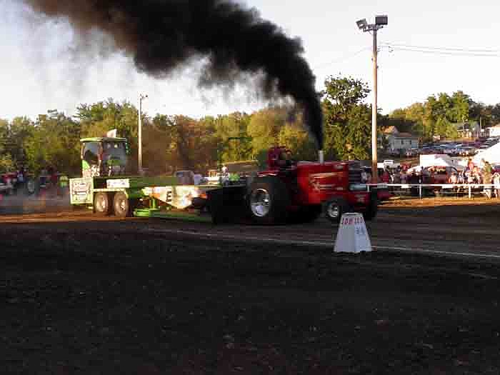 Brandon Trinklein, Jefferson City, in his 1066 International Harvester, pulls a distance of 302.08 feet for a first place finish in the 8,500 Limited Pro-Stock Tractor Class.