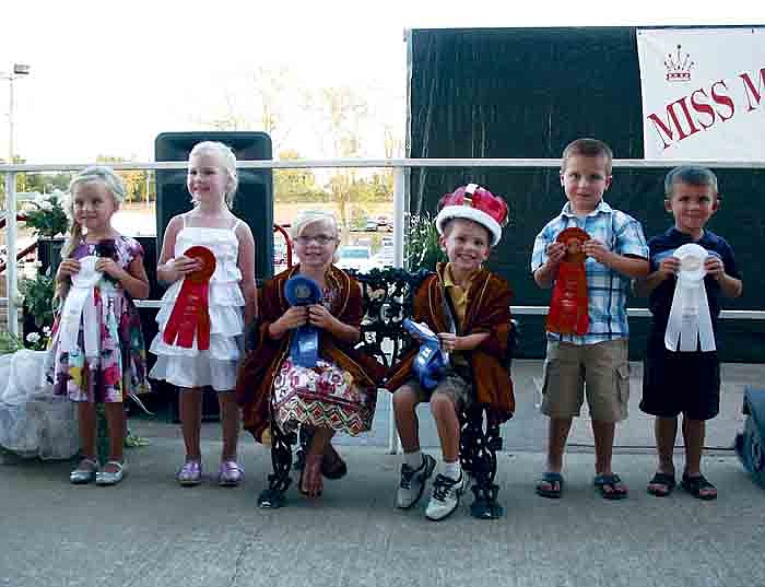 Crowned the 2012 Little Mr. and Miss Moniteau County Tuesday, Aug. 7, at the main arena of the Moniteau County Fairgrounds, California, seated at center, from left, are Addison Harris, 5, daughter of Tim and Stephanie Harris, California, and Corbin Lawson, 4, son of Brian and Becky Lawson, California. Runners-up for Little Miss Moniteau County, from left, are second runner-up Brylie Kilson, 4, daughter of Chase Taggart and Samantha Kilson, California, and first runner-up Addasyn Hayden, 5, daughter of Andrew and Michelle Hayden, California. Runners-up for Little Mr. Moniteau County, at right, from left, are first runner-up Hudson Clay, 4, son of Andy and Kacey Clay, Jamestown, and second runner-up Flinton Percival, 4, son or Rick and LaTonya Percival, Russellville.