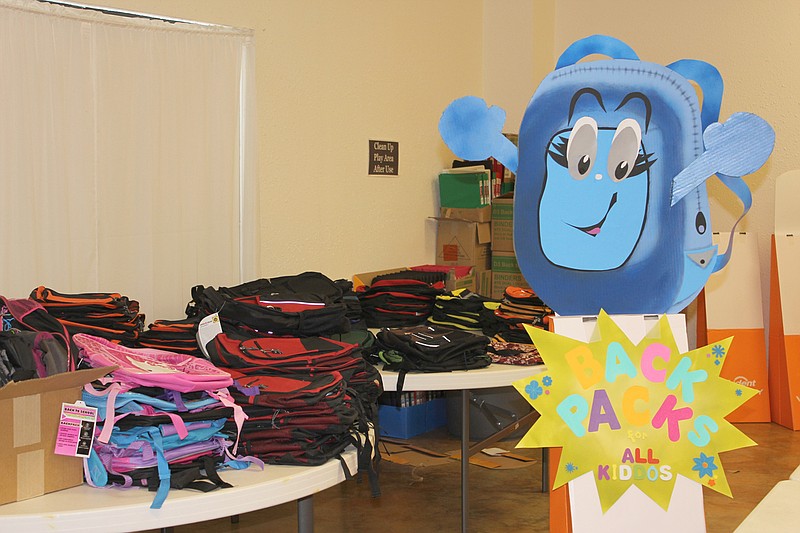 Backpacks are stacked on a table at Callaway Christian Church Thursday afternoon, waiting to be filled by area children on Saturday as part of SERVE Inc.'s Back to School Supplies and Services Fair. To be held from 9 a.m. to 3 p.m. at the church, located at 2051 Silver Dr. in Fulton, the event includes free school supplies, health screenings, haircuts, lunch and information on a variety of community resources.