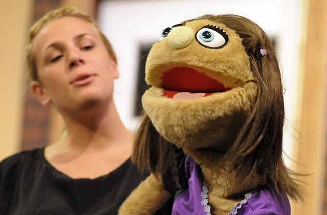 Kate Monster explains how monsters are not so bad during a monologue portion of Avenue Q. The new musical comedy is being preformed by the Capital City Players. 