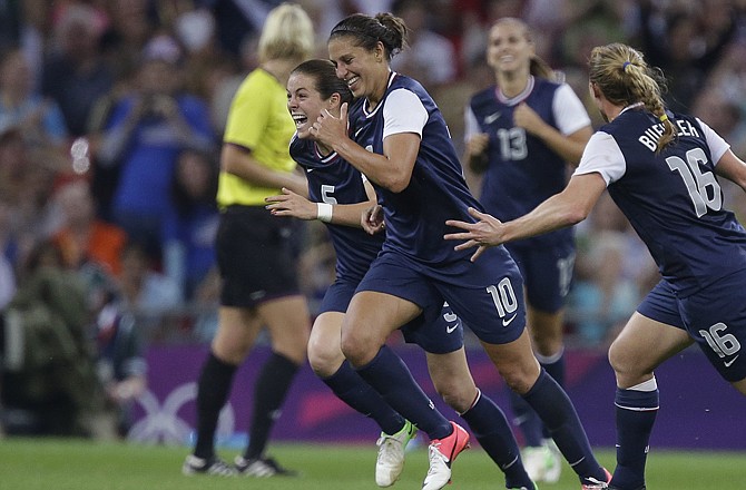 Carli Lloyd (10) celebrates her goal with her United States teammates during the women's soccer gold medal match Thursday in London. The U.S. defeated Japan 2-1.