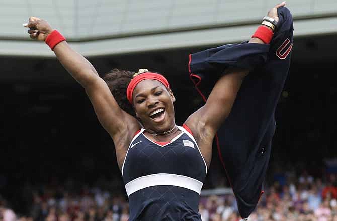 In this Saturday, Aug. 4, 2012 photo, United States' Serena Williams celebrates after defeating Maria Sharapova of Russia to win the women's singles gold medal match at the All England Lawn Tennis Club at Wimbledon, in London, at the 2012 Summer Olympics. 
