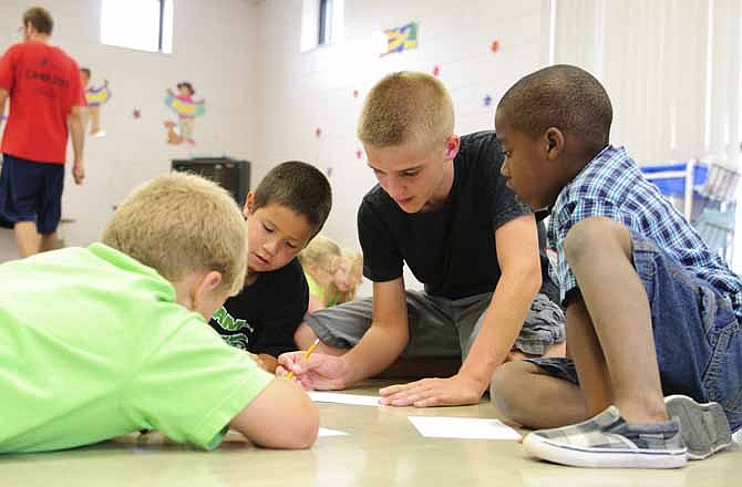 Eli Raithel, a YMCA counselor in training, said CITs run daily errands through the complex, help get lunch ready and assist with taking young campers to and from swimming lessons, the restrooms and more. 