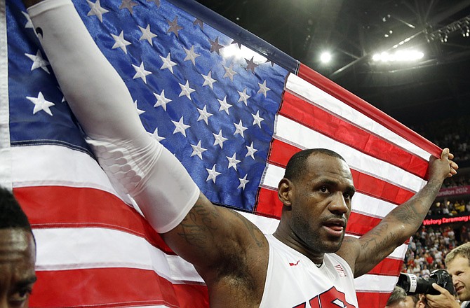 The United States' LeBron James celebrates after the men's gold medal basketball game Sunday in London. The Americans beat Spain 107-100.