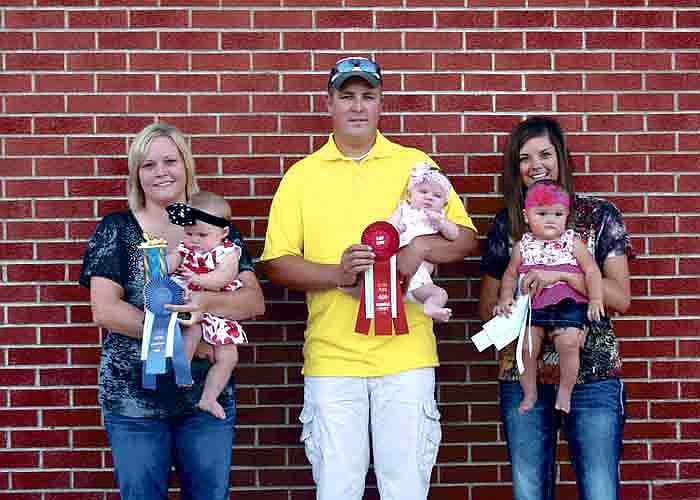 Winners of the Best Baby Girl Under 8 Months category at the Moniteau County Fair Baby Show Saturday evening at the main arena of the fairgrounds, California, from left, are: first place, Logan Milligan, 7 months, son of Lisa and James Milligan, Clarksburg; second place, Bralynn Porter, 3 1/2 months, daughter of Landon and Jennifer Porter, California; and third place, Addelyn McGill, 7 1/2 months, daughter of Chelsea and Alex McGill, California.