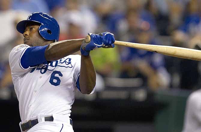 Kansas City Royals' Lorenzo Cain (6) hits an RBI-double off Oakland Athletics starting pitcher Brandon McCarthy during the seventh inning of a baseball game at Kauffman Stadium in Kansas City, Mo., Wednesday, Aug. 15, 2012. 