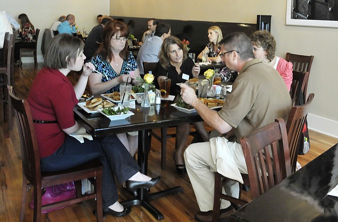 Friends and co-workers gather for lunch at the Grand Cafe, a new restaurant in downtown Jefferson City. Clockwise from left, Jill Hancock, Melissa Robinson, Elisa Pellham, Brenda Kaden and Scott Penman enjoy their freshly prepared sandwiches and salads.