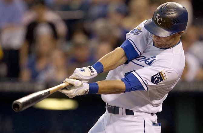 Kansas City Royals' Alex Gordon hits an RBI double off Chicago White Sox starting pitcher Jake Peavy during the first inning of a baseball game at Kauffman Stadium in Kansas City, Mo., Saturday, Aug. 18, 2012. 