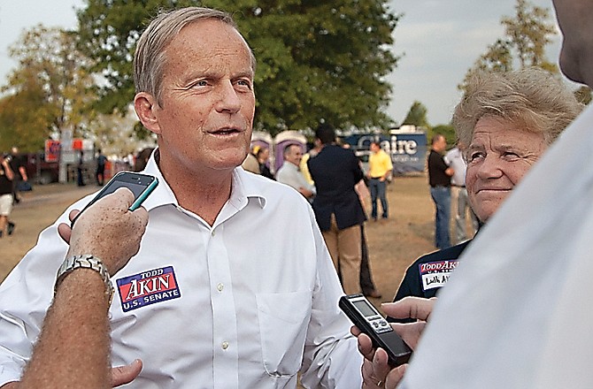 Rep. Todd Akin, R-Mo., and his wife, Lulli, talk with reporters at the Missouri State Fair.