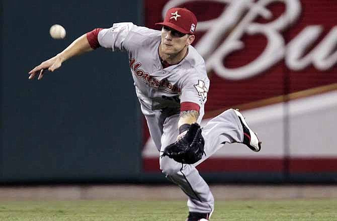 Houston Astros center fielder Brandon Barnes makes a catch on a ball hit by St. Louis Cardinals' Allen Craig in the sixth inning of a baseball game on Wednesday, Aug. 22, 2012, in St. Louis. 