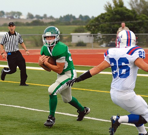 Blair Oaks' Caleb Bischoff catches a long pass Friday evening against Moberly for a touchdown at the Falcon Athletic Complex. The Falcons won 24-14.