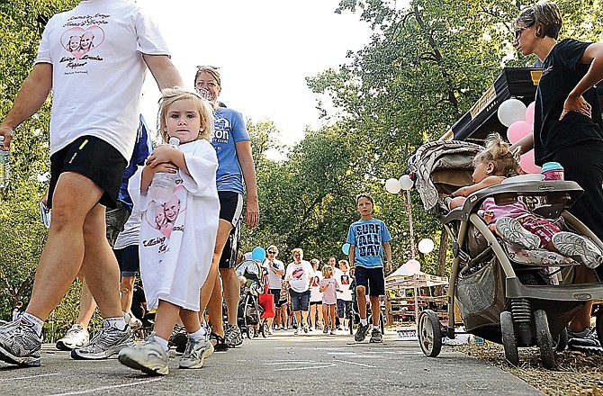 Walkers of all ages begin their trek while participating in the American Heart Association 2012 Jefferson City Heart Walk at Memorial Park.