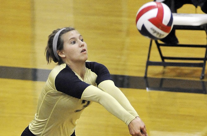 Helias' Haley Bax goes for a dig during a game last season.