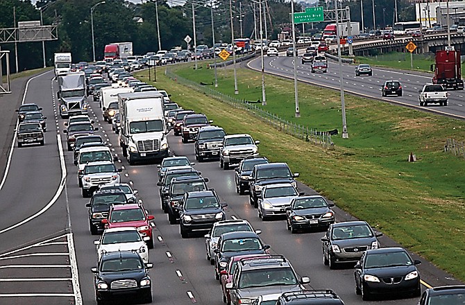 A line of traffic extends down Interstate 10 heading toward Baton Rouge, as many residents leave the New Orleans area.